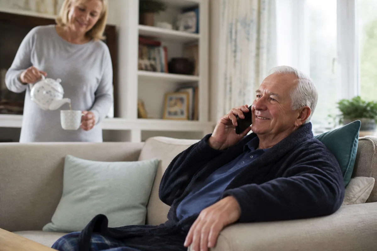 Older woman and family member calmly choosing supportive phone technology
